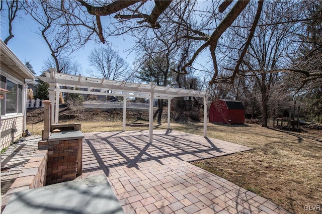 view of patio featuring a storage shed, an outdoor structure, and a pergola