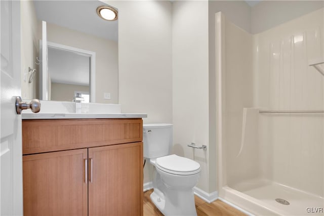 full bath featuring vanity, a shower stall, and toilet