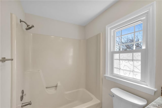 full bathroom featuring toilet and washtub / shower combination