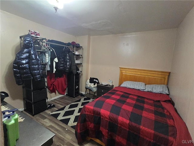 bedroom with wood finished floors