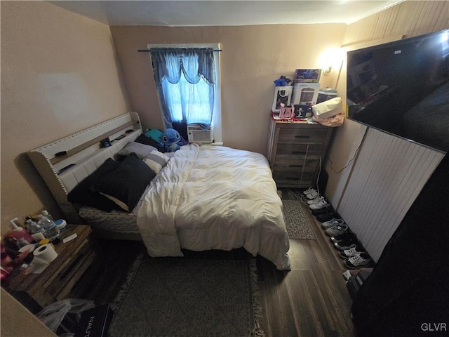 bedroom featuring wood finished floors