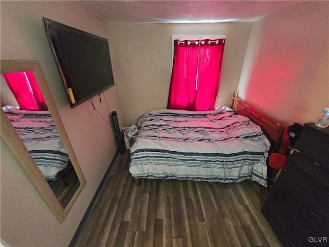 bedroom with wood finished floors