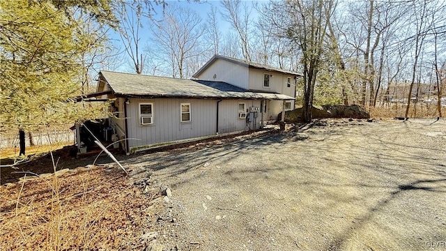 view of side of home with driveway