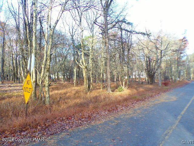 view of street featuring a view of trees