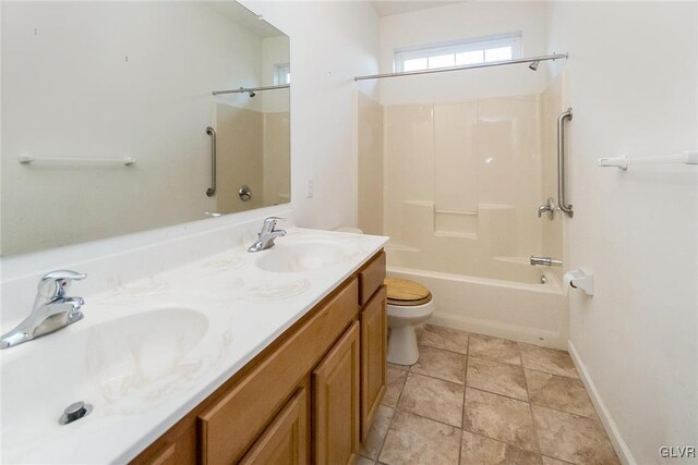 bathroom with double vanity, shower / bath combination, toilet, and a sink