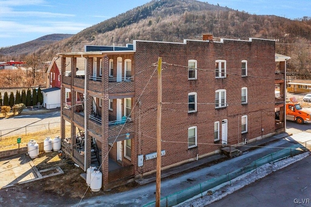 view of building exterior with a mountain view