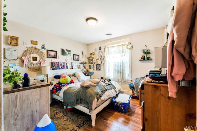 bedroom featuring wood finished floors