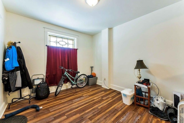 misc room with wood finished floors and baseboards