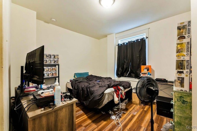 bedroom with wood finished floors