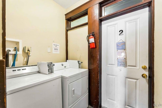 washroom with laundry area and washing machine and dryer