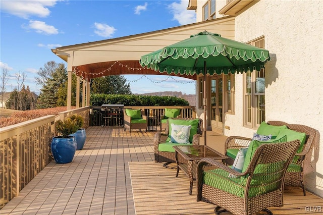 wooden deck with outdoor lounge area