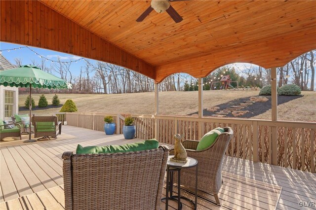 wooden terrace with a ceiling fan