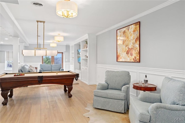 game room featuring visible vents, built in shelves, ornamental molding, billiards, and wood finished floors