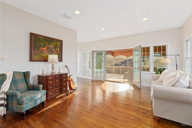 sitting room featuring visible vents, recessed lighting, and wood finished floors