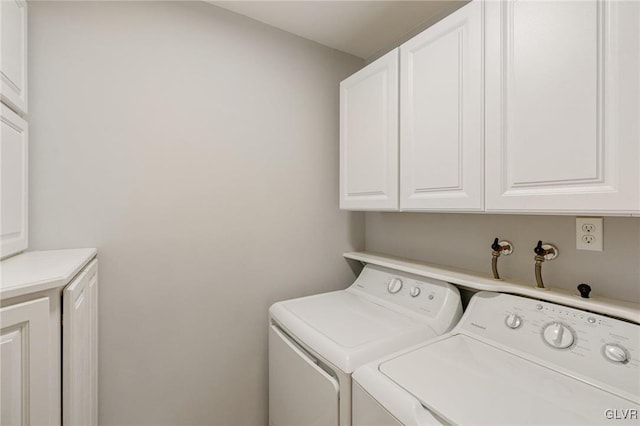 laundry area featuring cabinet space and independent washer and dryer