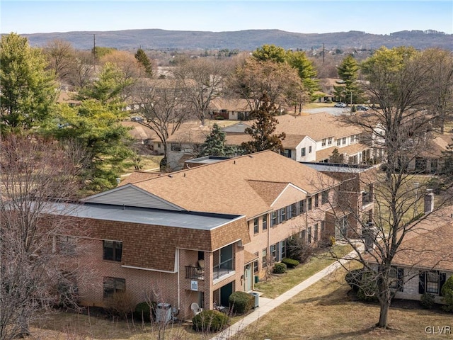 drone / aerial view featuring a mountain view