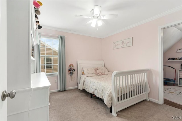 carpeted bedroom with a ceiling fan, crown molding, and baseboards