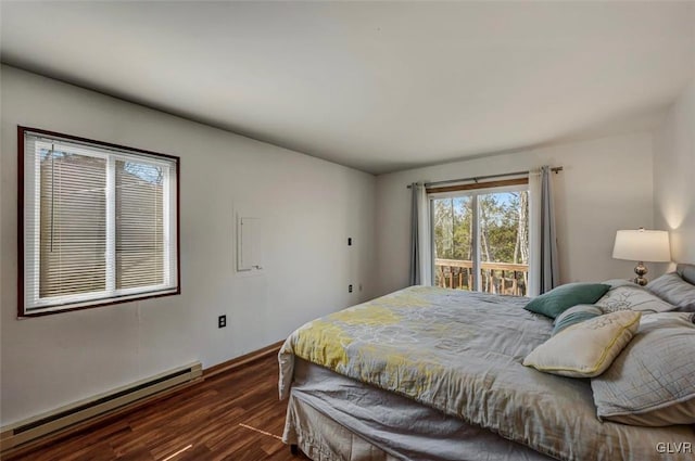 bedroom featuring dark wood finished floors, access to exterior, and baseboard heating