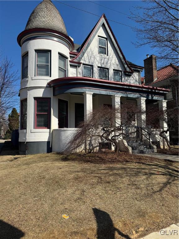 victorian-style house featuring stucco siding