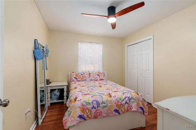 bedroom featuring a closet, wood finished floors, and a ceiling fan