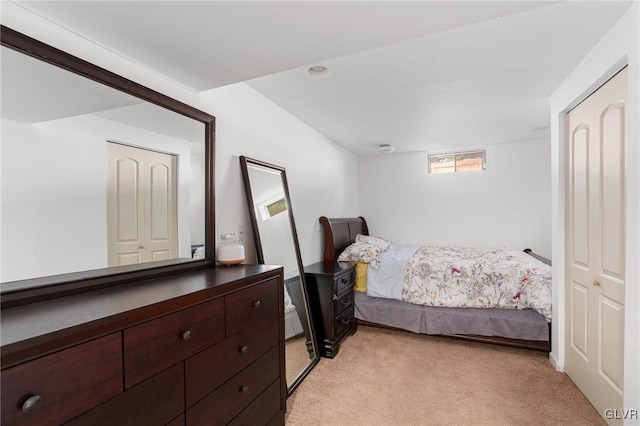 bedroom featuring light colored carpet