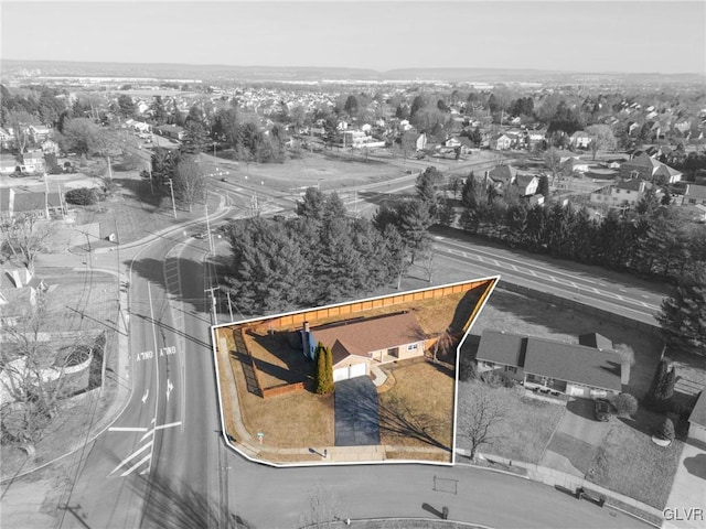 birds eye view of property with a residential view