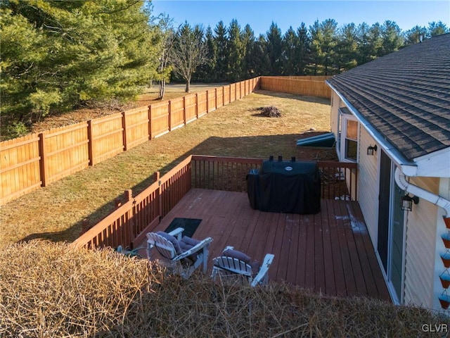 view of yard featuring a fenced backyard and a wooden deck