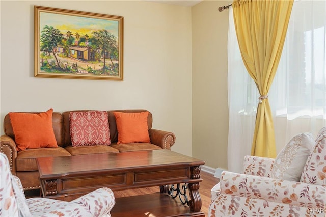 living room with wood finished floors and baseboards