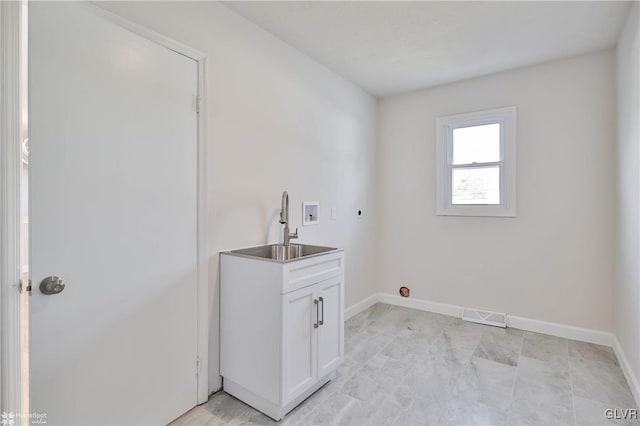 laundry area featuring baseboards, visible vents, hookup for an electric dryer, a sink, and washer hookup