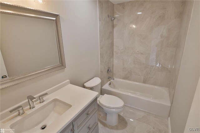 bathroom with vanity, toilet, and shower / bathtub combination