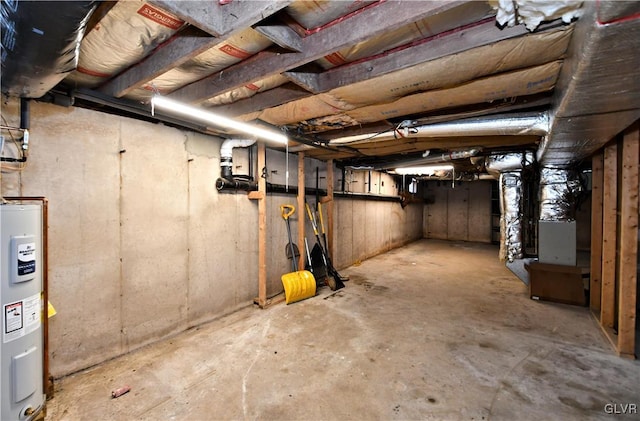 unfinished below grade area with heating unit and electric water heater