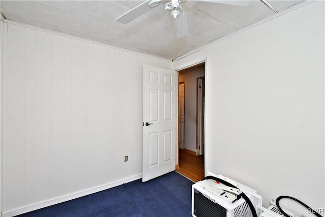 empty room featuring baseboards and ceiling fan