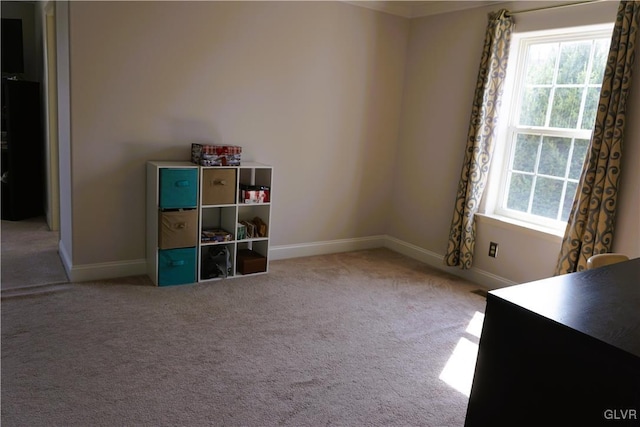 interior space featuring baseboards