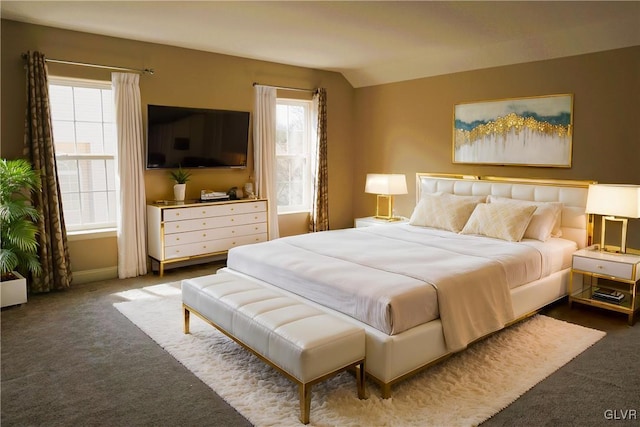 bedroom featuring carpet and lofted ceiling