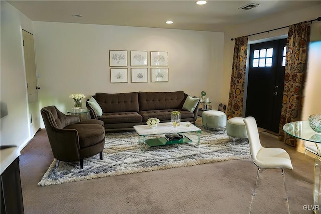 living area featuring visible vents, recessed lighting, and carpet