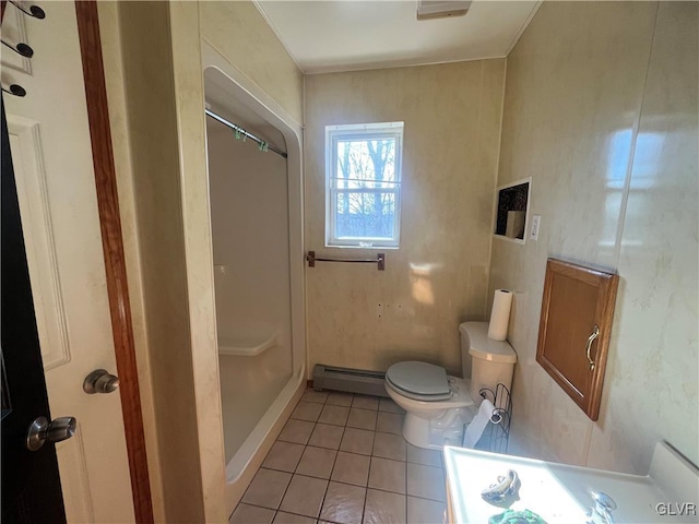 bathroom with a shower, a baseboard radiator, toilet, and tile patterned flooring