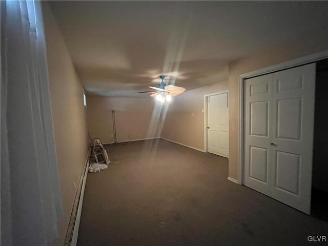 unfurnished room featuring baseboards, baseboard heating, and ceiling fan