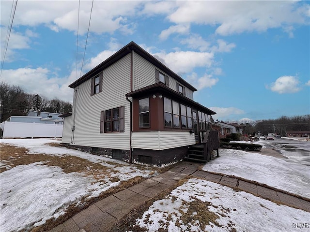 view of front of house with fence