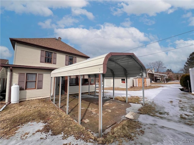 exterior space with a carport