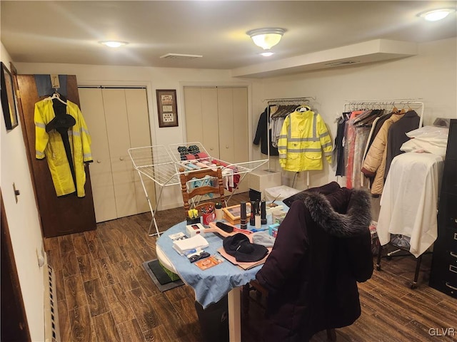 interior space featuring visible vents and wood finished floors