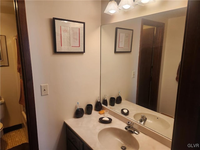 full bathroom with vanity and toilet