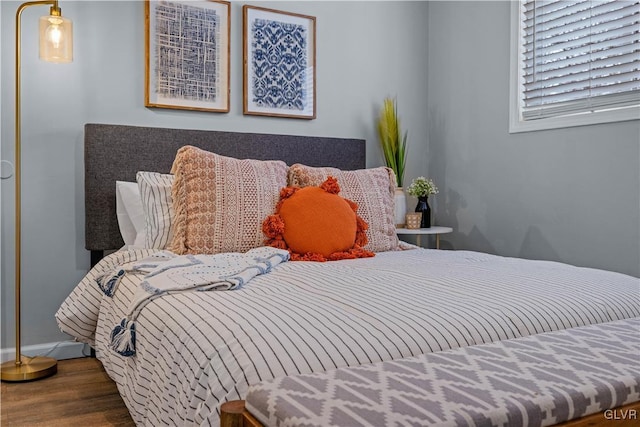 bedroom with wood finished floors