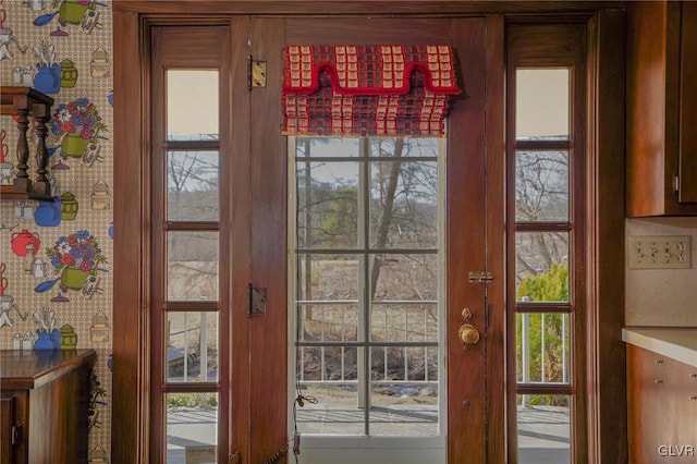 entryway with wallpapered walls