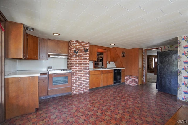 kitchen with black appliances, light countertops, under cabinet range hood, dark floors, and brown cabinets