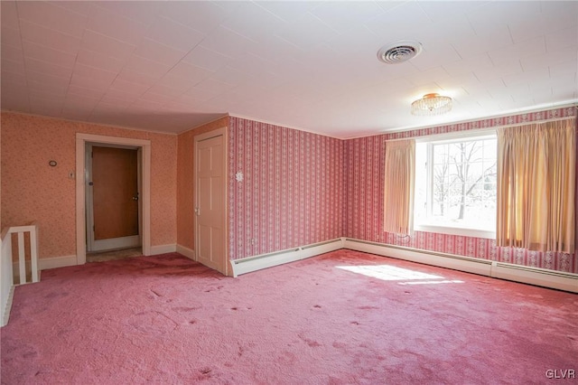 carpeted spare room featuring visible vents, baseboards, and wallpapered walls