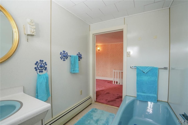 full bath featuring a baseboard heating unit and a washtub