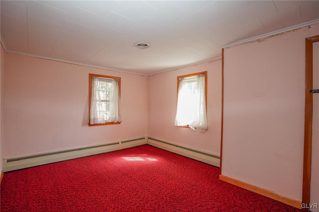 unfurnished room featuring ornamental molding, a healthy amount of sunlight, carpet floors, and a baseboard radiator