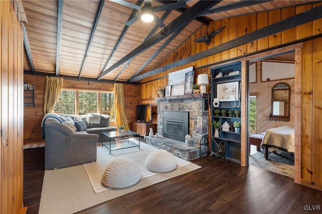 living area featuring beamed ceiling, high vaulted ceiling, wood finished floors, wood walls, and a fireplace