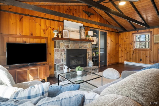 living area featuring wood finished floors, wooden walls, a fireplace, a baseboard radiator, and vaulted ceiling with beams