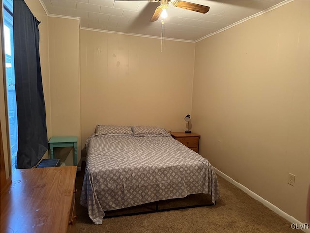 carpeted bedroom with ceiling fan, baseboards, and ornamental molding